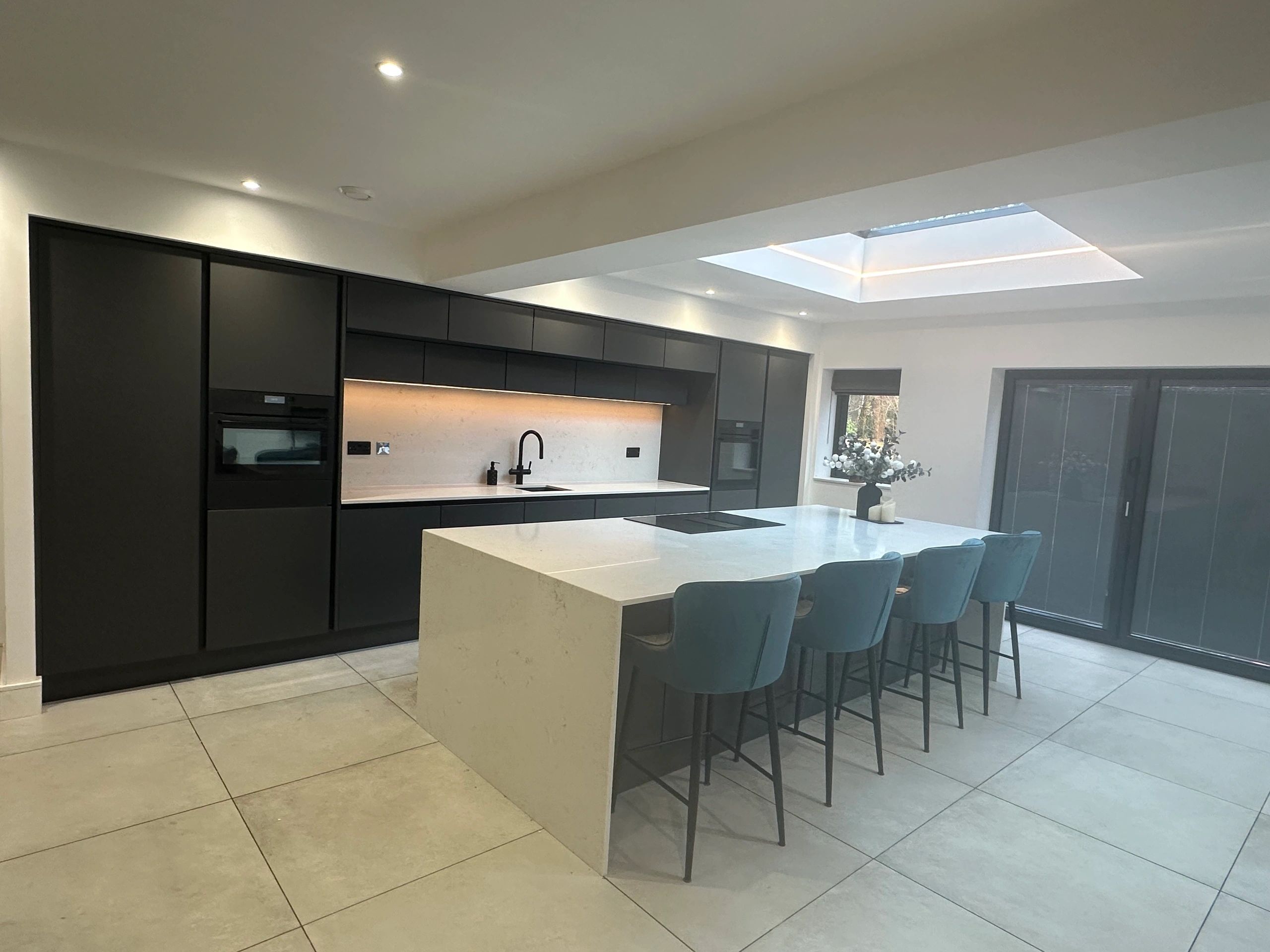 Completed renovation project — open-plan kitchen and dining area